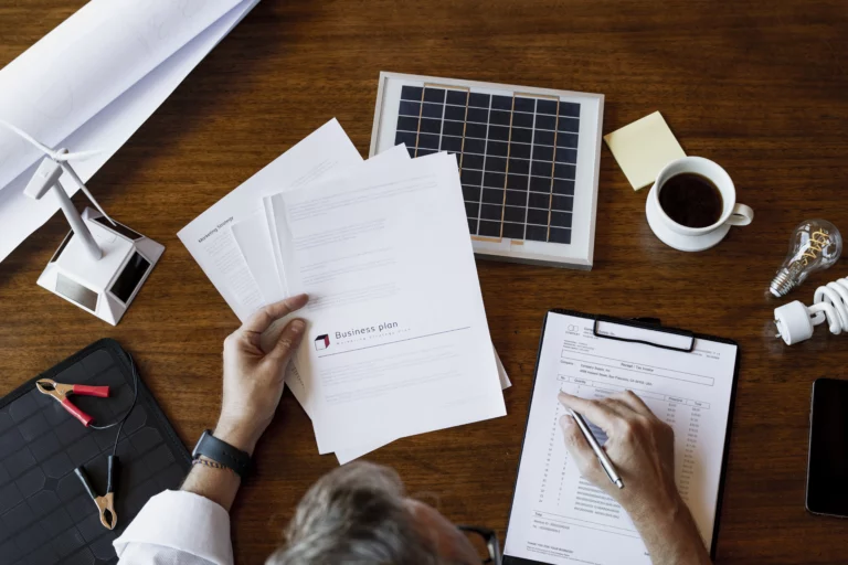 A Solar Power Tucson team member prepares the necessary paperwork and permits for a soon-to-be-installed system.