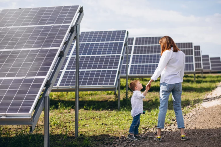 A mother teaches her young son about environmental responsibility as they visit a solar power farm in AZ
